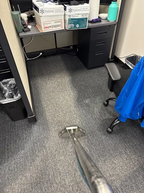 Extraction wand pulling water out of office carpet